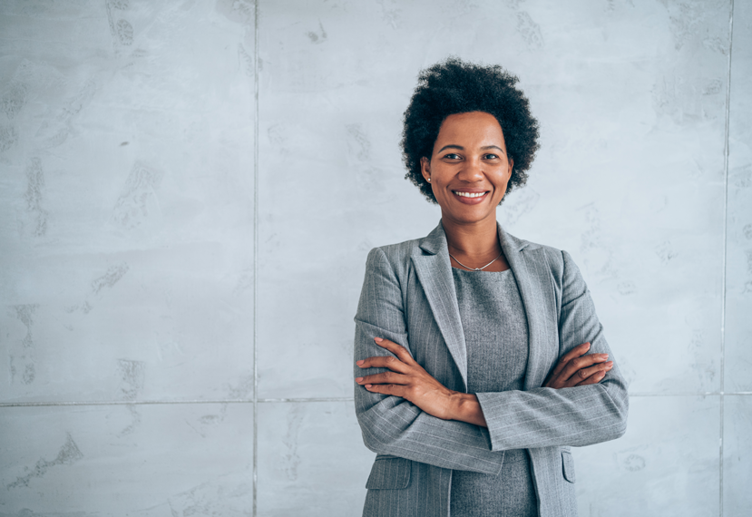 Confident business woman smiling.