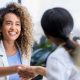 Woman Greeting Client
