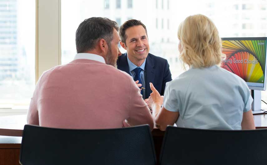 Professional man meeting with a couple in the office.