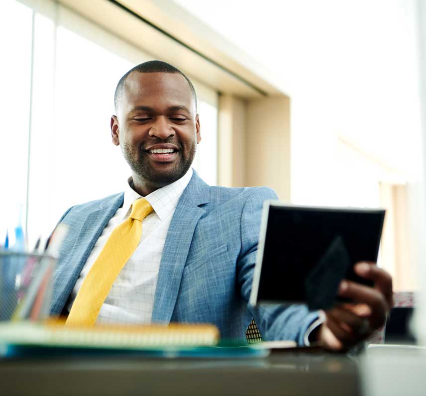 Professional man looking at a tablet.