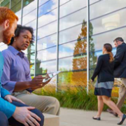 Coworkers sitting outside in a conversation.