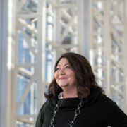 Woman smiling inside Edward Jones Corporate building.