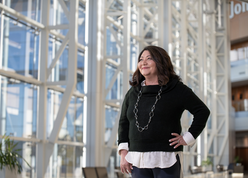 woman smiling in Edward Jones corporate building.