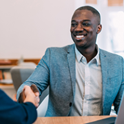 A man shaking hand with a woman.