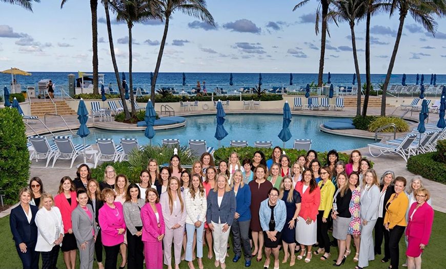 group of women advisors at a tropical resort.