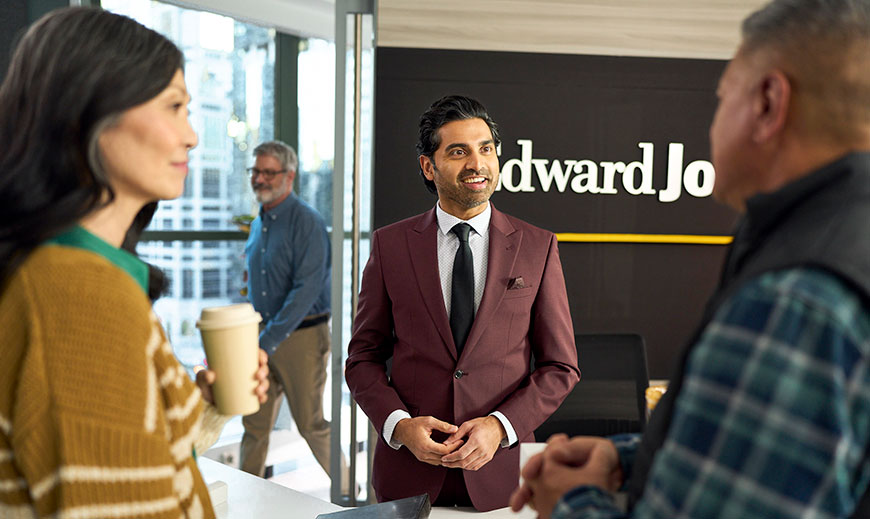 A group of people speaking in an Edward Jones office.