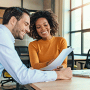 Two business professionals discussing at a table.