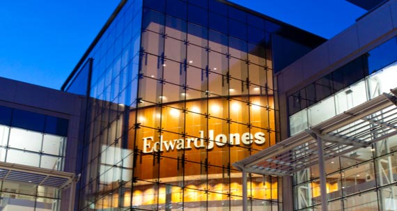 Exterior night photo of an Edwards Jones headquarters building.