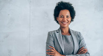Confident business woman smiling.