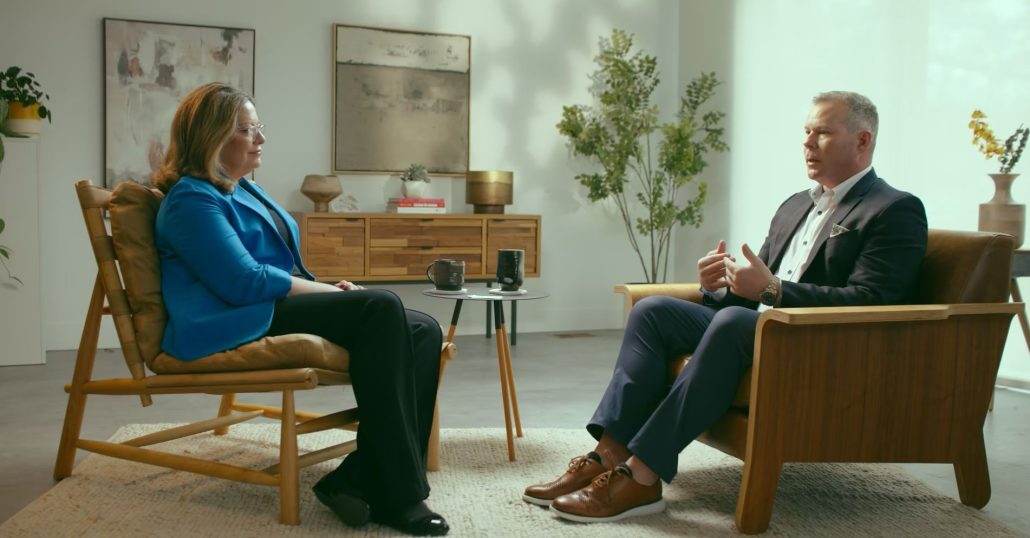 Kristy A Stadnyk and Michael Fessler, sitting in on office discussing Customer Support Team