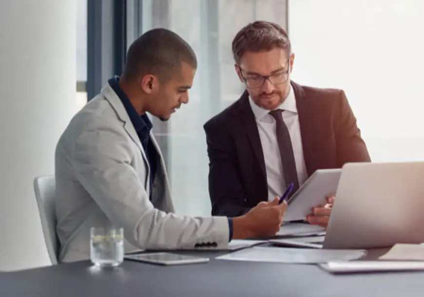 two businessmen having an office meeting