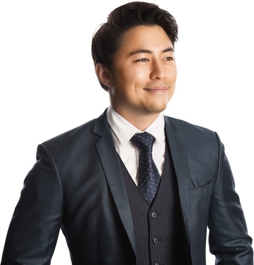 Confident, young male dressed in business suit looking into the distance.